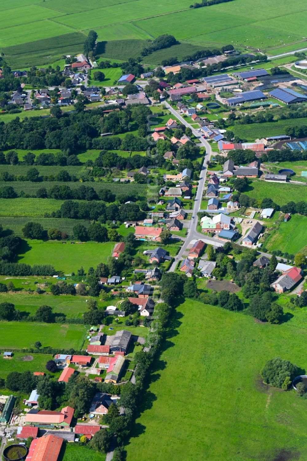 Aerial image Friedrichsholm - Agricultural land and field boundaries surround the settlement area of the village in Friedrichsholm in the state Schleswig-Holstein, Germany