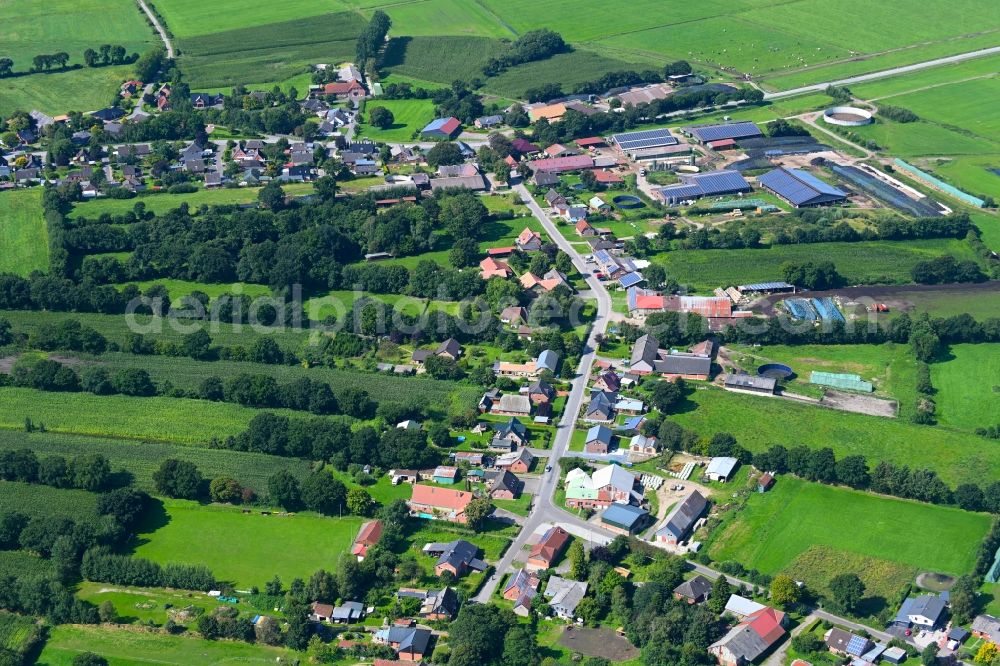 Aerial photograph Friedrichsholm - Agricultural land and field boundaries surround the settlement area of the village in Friedrichsholm in the state Schleswig-Holstein, Germany