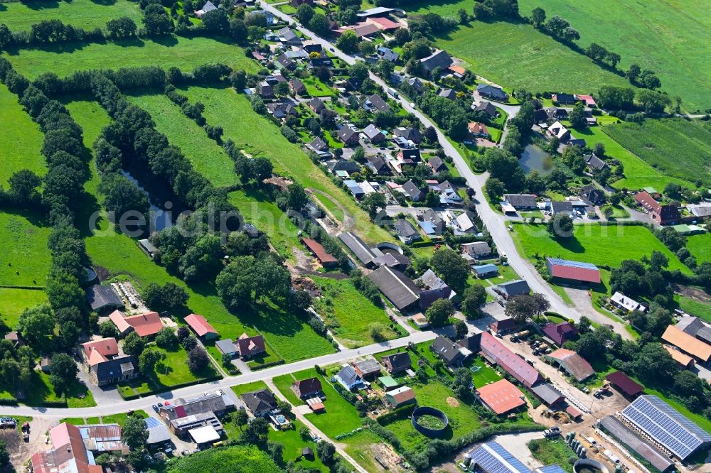 Aerial image Friedrichsholm - Agricultural land and field boundaries surround the settlement area of the village in Friedrichsholm in the state Schleswig-Holstein, Germany