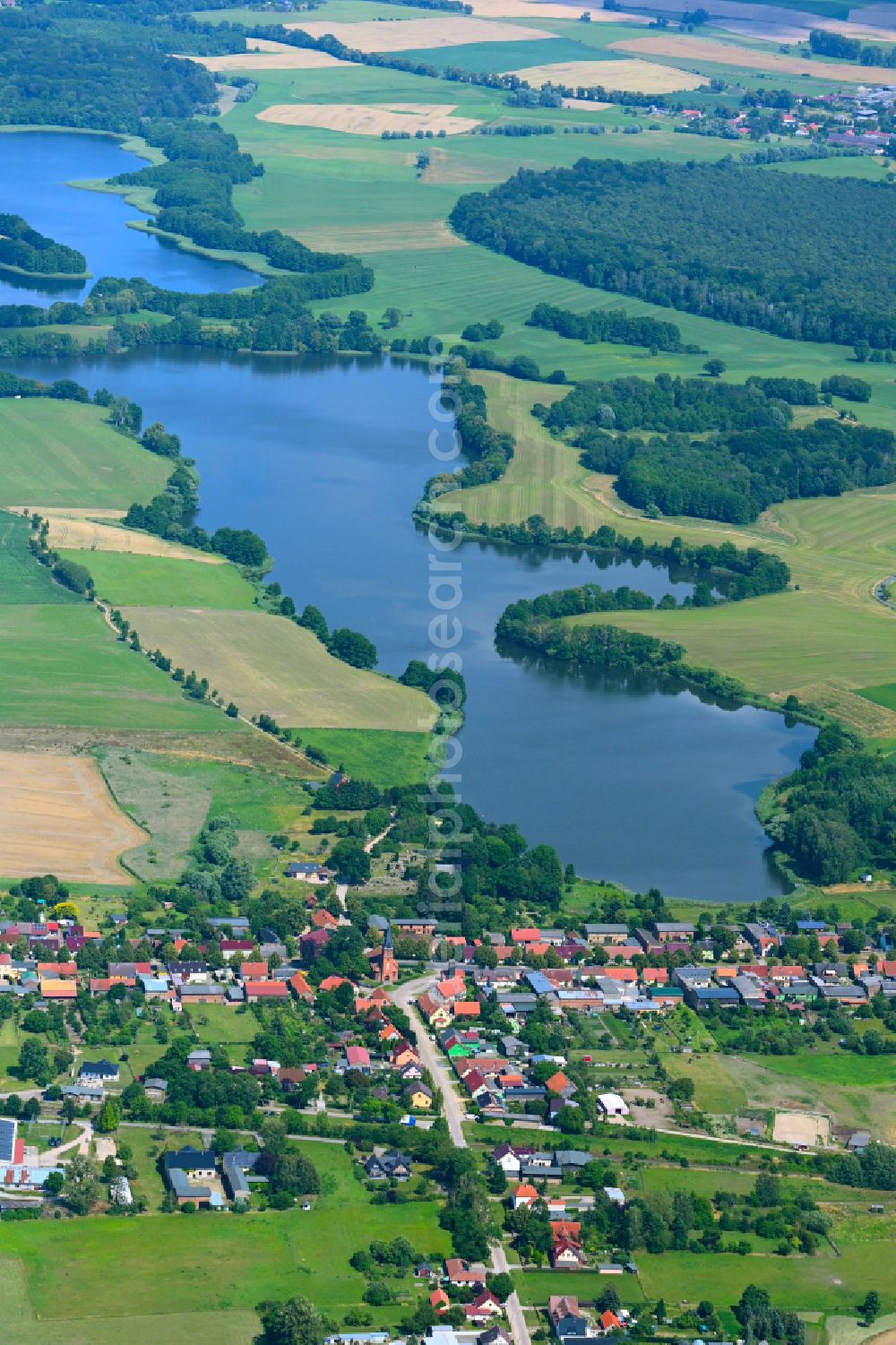 Friedrichswalde from above - Agricultural land and field boundaries surround the settlement area of the village in Friedrichswalde in the state Brandenburg, Germany