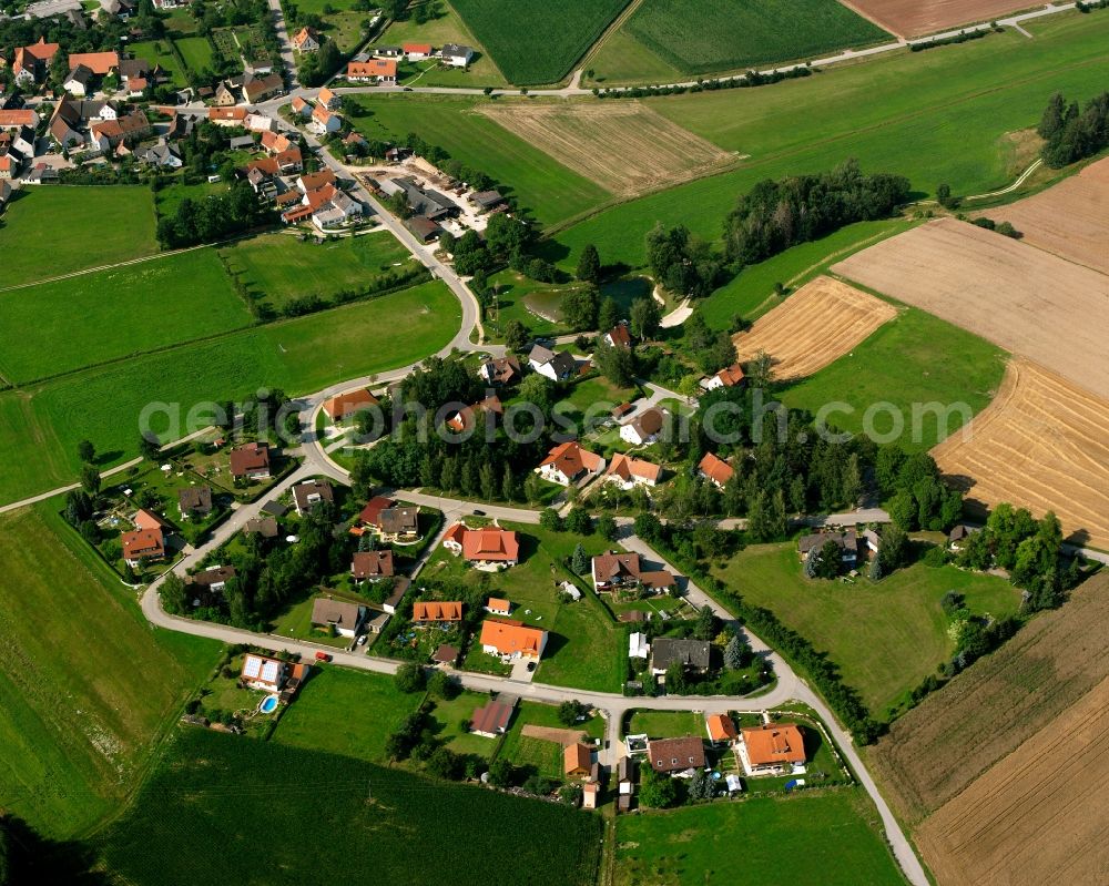 Fürnheim from above - Agricultural land and field boundaries surround the settlement area of the village in Fürnheim in the state Bavaria, Germany