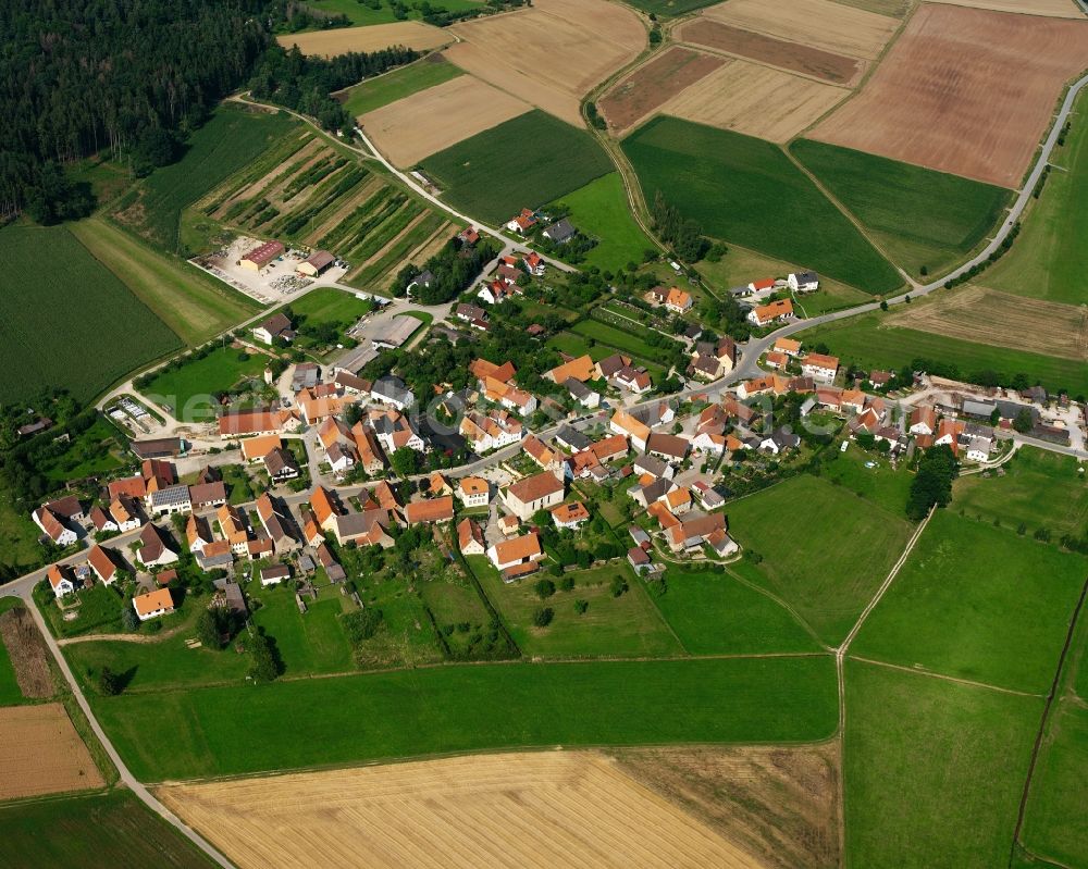 Fürnheim from the bird's eye view: Agricultural land and field boundaries surround the settlement area of the village in Fürnheim in the state Bavaria, Germany