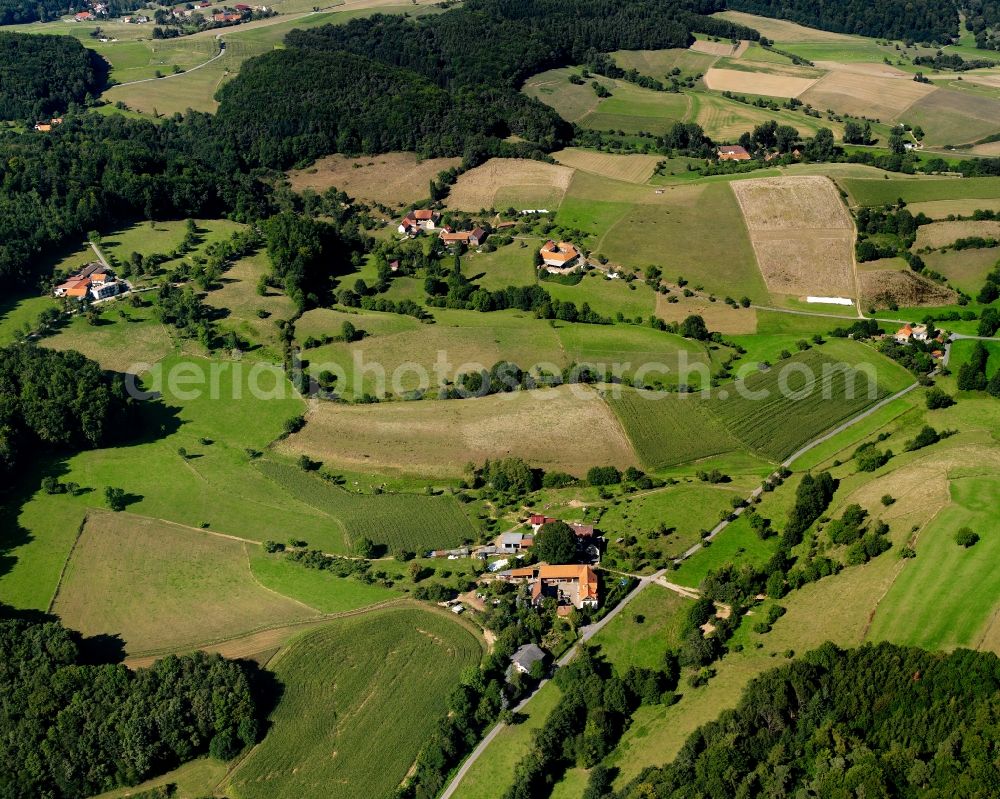 Aerial photograph Fränkisch-Crumbach - Agricultural land and field boundaries surround the settlement area of the village in Fränkisch-Crumbach in the state Hesse, Germany