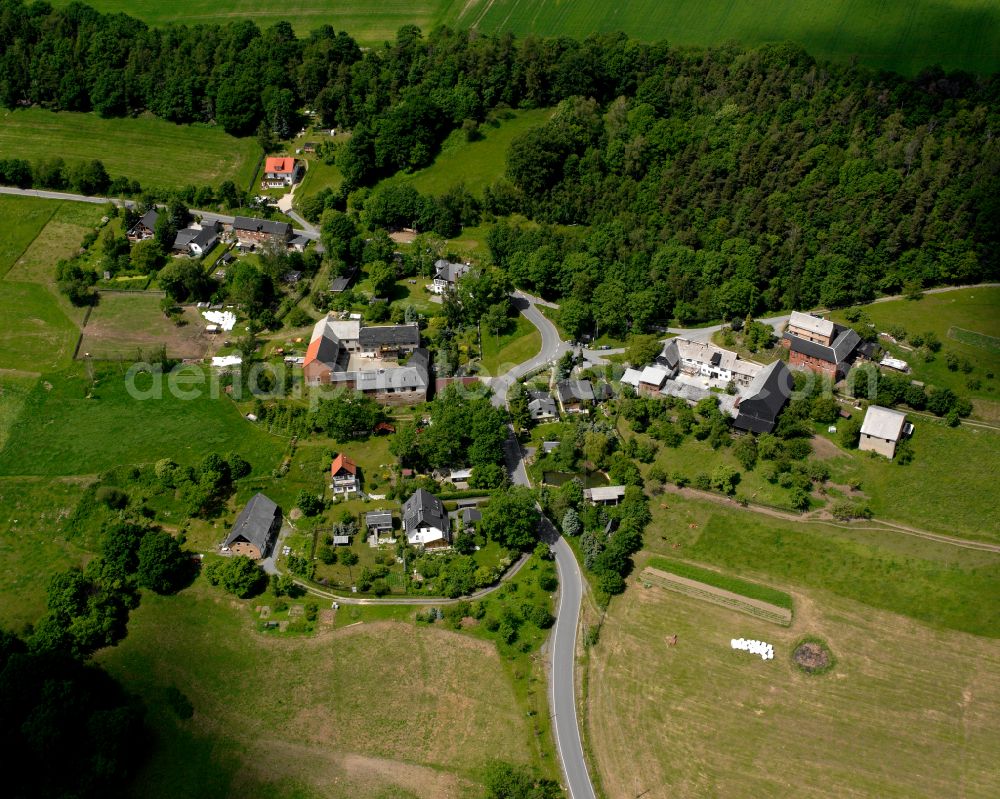 Frotschau from above - Agricultural land and field boundaries surround the settlement area of the village in Frotschau in the state Thuringia, Germany