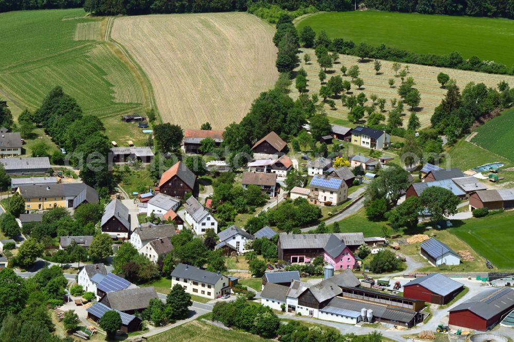 Förstenreuth from above - Agricultural land and field boundaries surround the settlement area of the village in Foerstenreuth in the state Bavaria, Germany