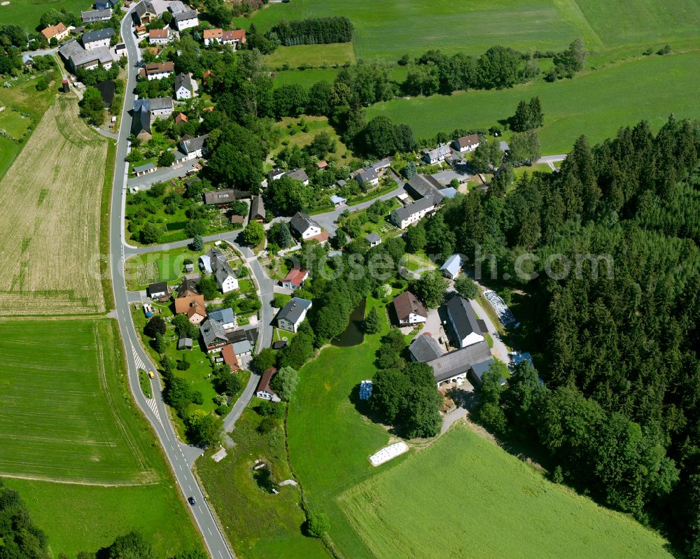 Förstenreuth from the bird's eye view: Agricultural land and field boundaries surround the settlement area of the village in Förstenreuth in the state Bavaria, Germany