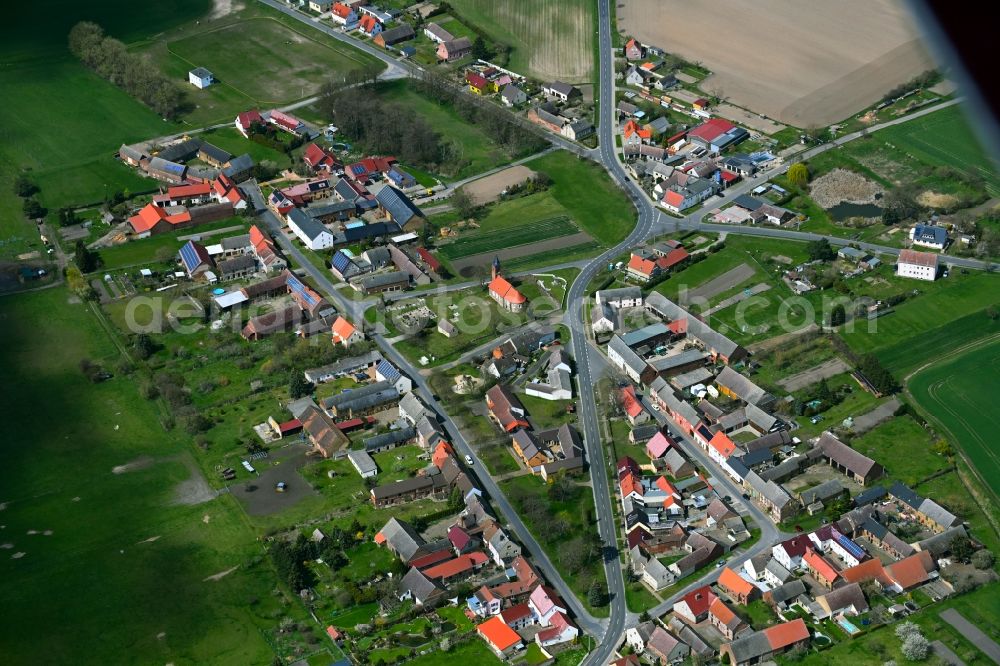 Gadegast from above - Agricultural land and field boundaries surround the settlement area of the village in Gadegast in the state Saxony-Anhalt, Germany