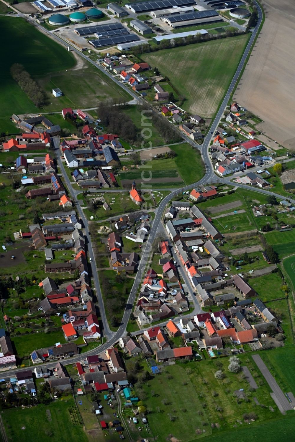 Gadegast from the bird's eye view: Agricultural land and field boundaries surround the settlement area of the village in Gadegast in the state Saxony-Anhalt, Germany