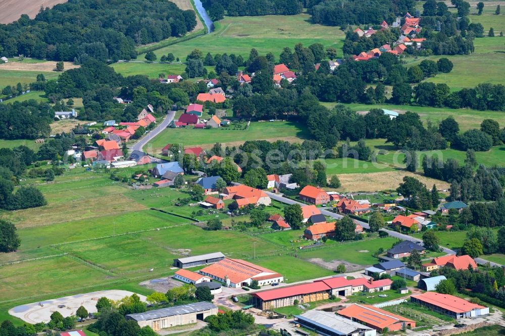 Garlitz from the bird's eye view: Agricultural land and field boundaries surround the settlement area of the village in Garlitz in the state Mecklenburg - Western Pomerania, Germany