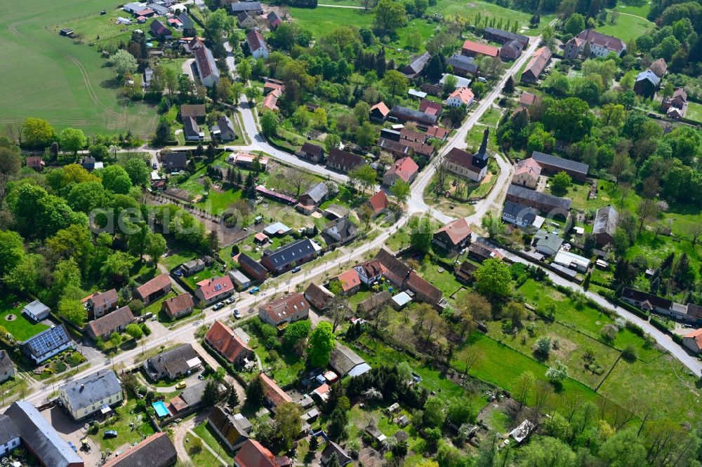 Garz from above - Agricultural land and field boundaries surround the settlement area of the village in Garz in the state Brandenburg, Germany