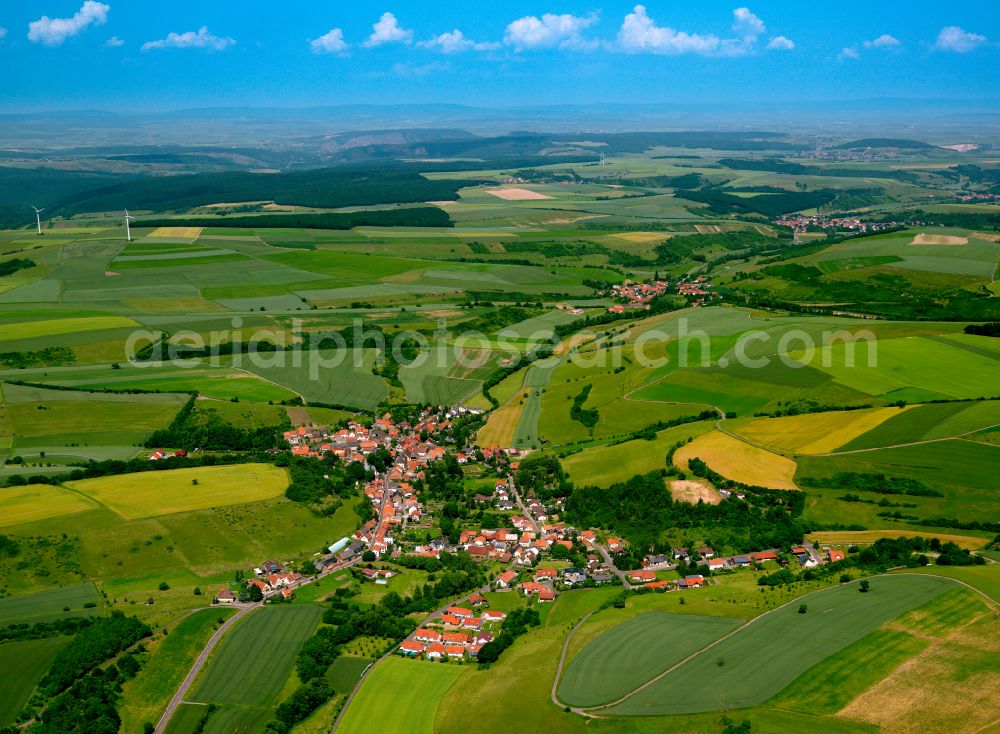 Aerial image Gaugrehweiler - Agricultural land and field boundaries surround the settlement area of the village in Gaugrehweiler in the state Rhineland-Palatinate, Germany