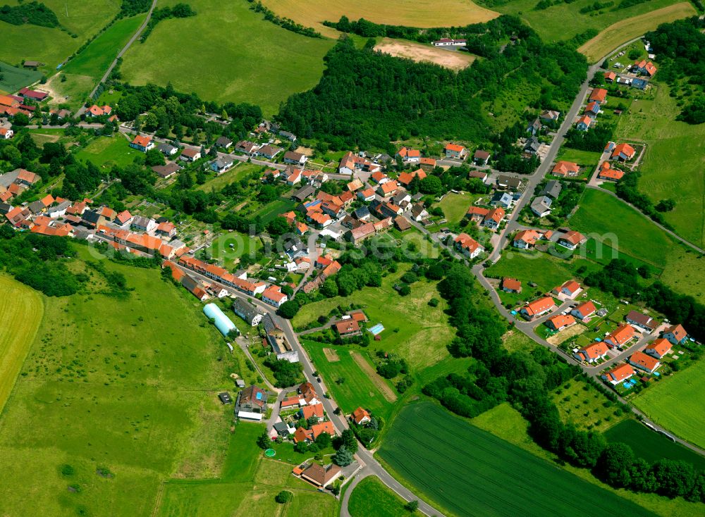 Aerial image Gaugrehweiler - Agricultural land and field boundaries surround the settlement area of the village in Gaugrehweiler in the state Rhineland-Palatinate, Germany