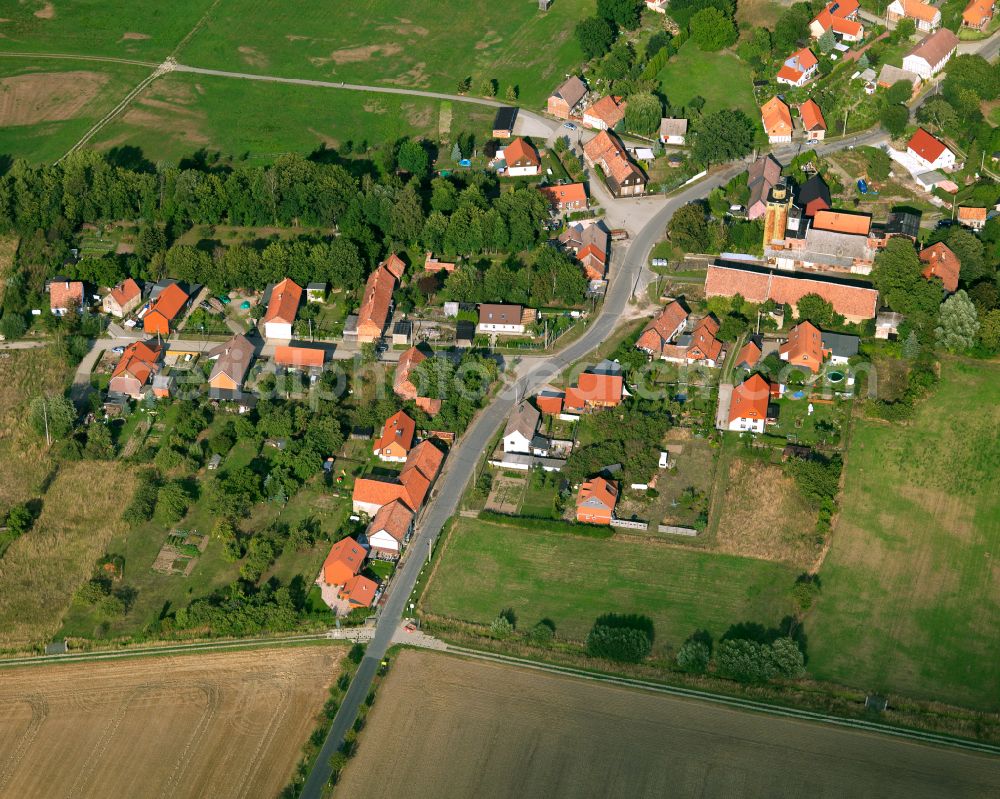 Göddeckenrode from above - Agricultural land and field boundaries surround the settlement area of the village in Göddeckenrode in the state Saxony-Anhalt, Germany