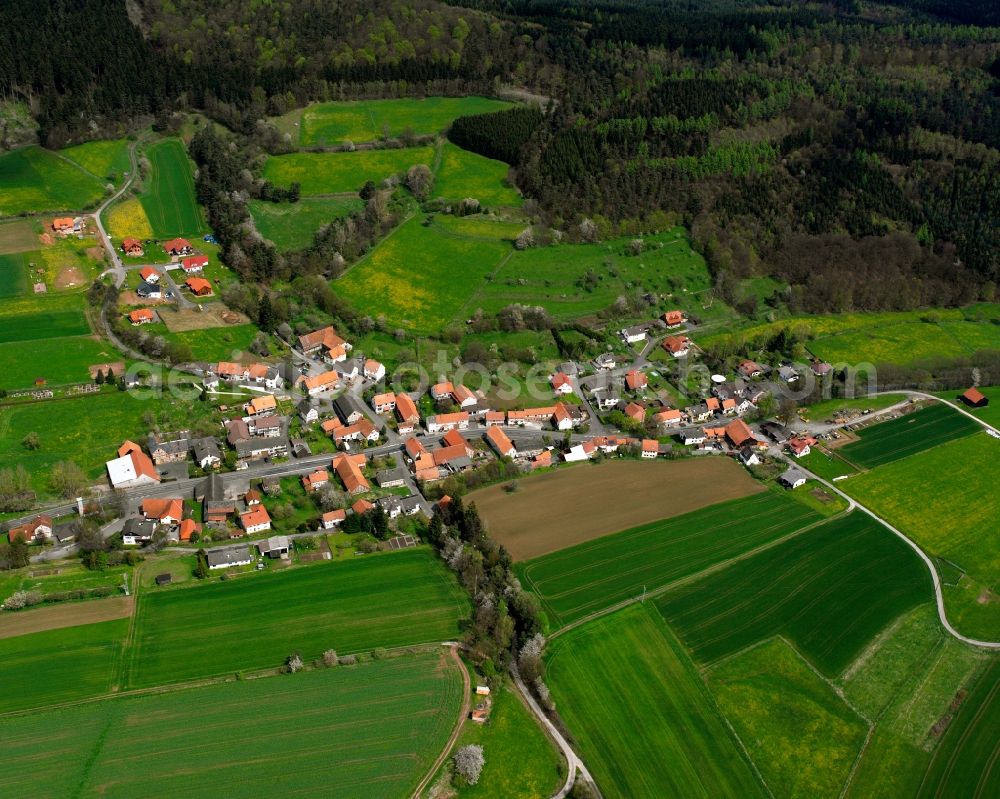 Gehau from the bird's eye view: Agricultural land and field boundaries surround the settlement area of the village in Gehau in the state Hesse, Germany