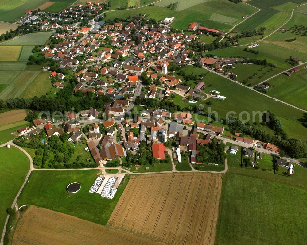 Geilsheim from above - Agricultural land and field boundaries surround the settlement area of the village in Geilsheim in the state Bavaria, Germany