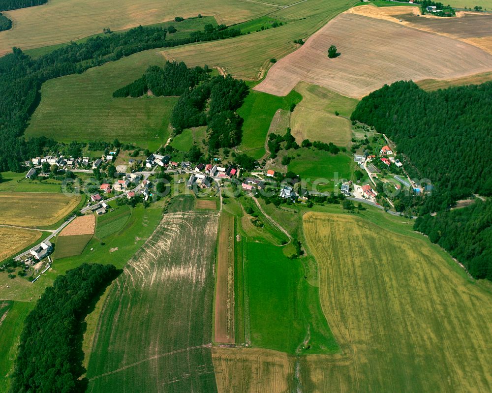 Geißendorf from above - Agricultural land and field boundaries surround the settlement area of the village in Geißendorf in the state Thuringia, Germany