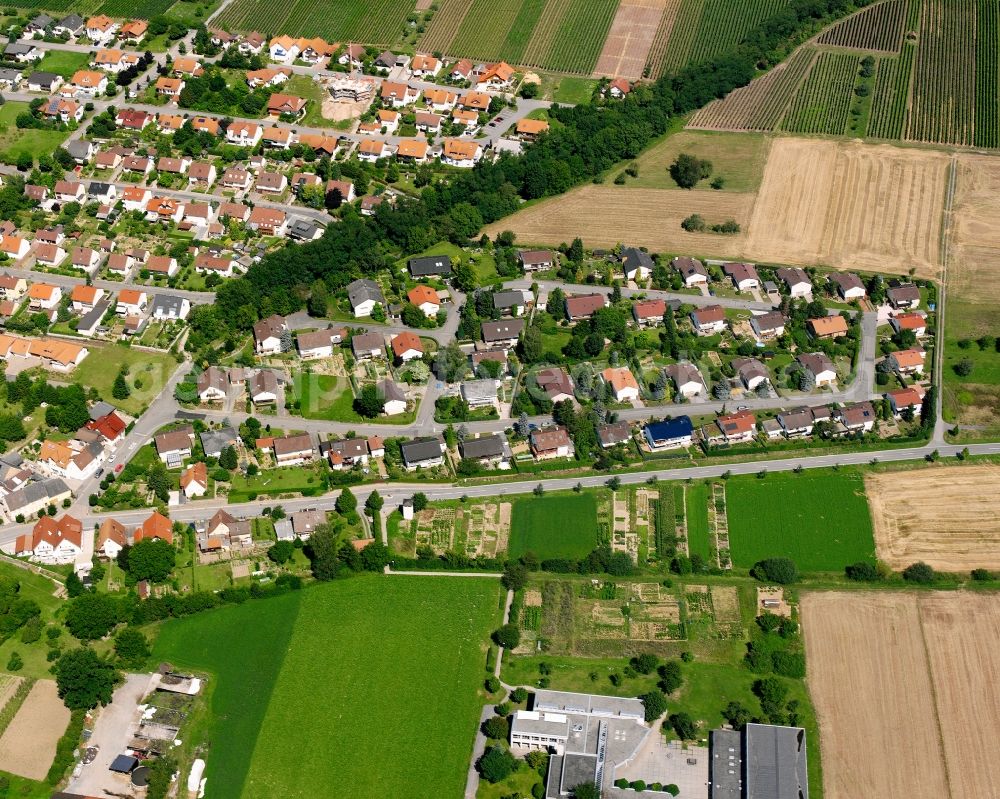 Gemmingen from the bird's eye view: Agricultural land and field boundaries surround the settlement area of the village in Gemmingen in the state Baden-Wuerttemberg, Germany