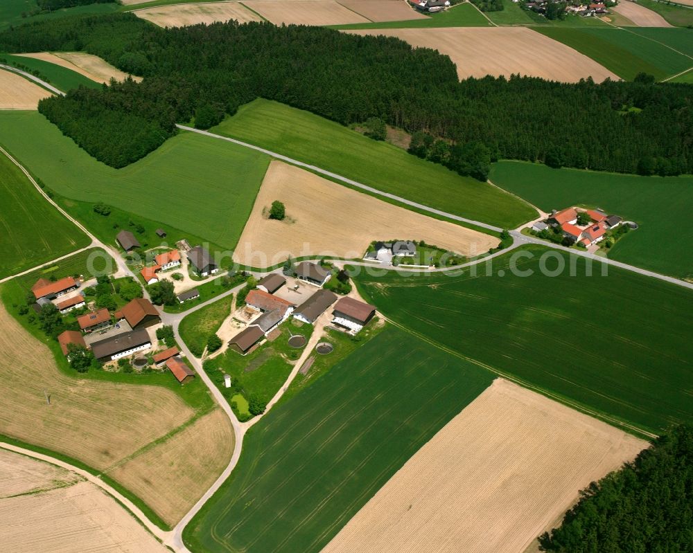 Gengham from above - Agricultural land and field boundaries surround the settlement area of the village in Gengham in the state Bavaria, Germany