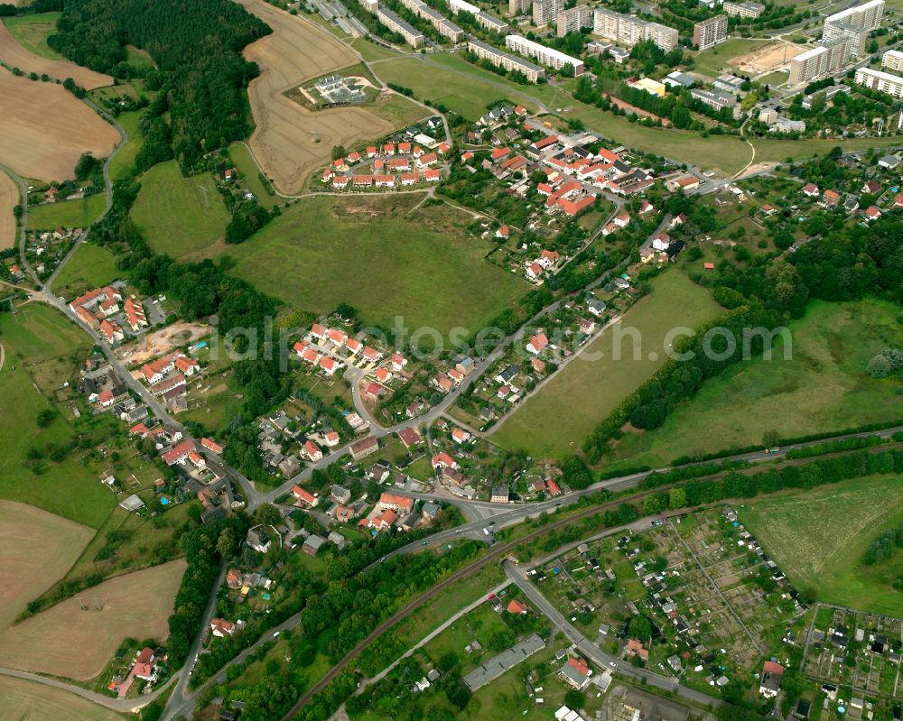 Gera from above - Agricultural land and field boundaries surround the settlement area of the village in Gera in the state Thuringia, Germany