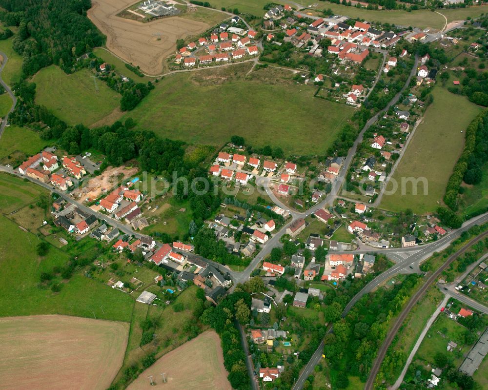 Gera from the bird's eye view: Agricultural land and field boundaries surround the settlement area of the village in Gera in the state Thuringia, Germany