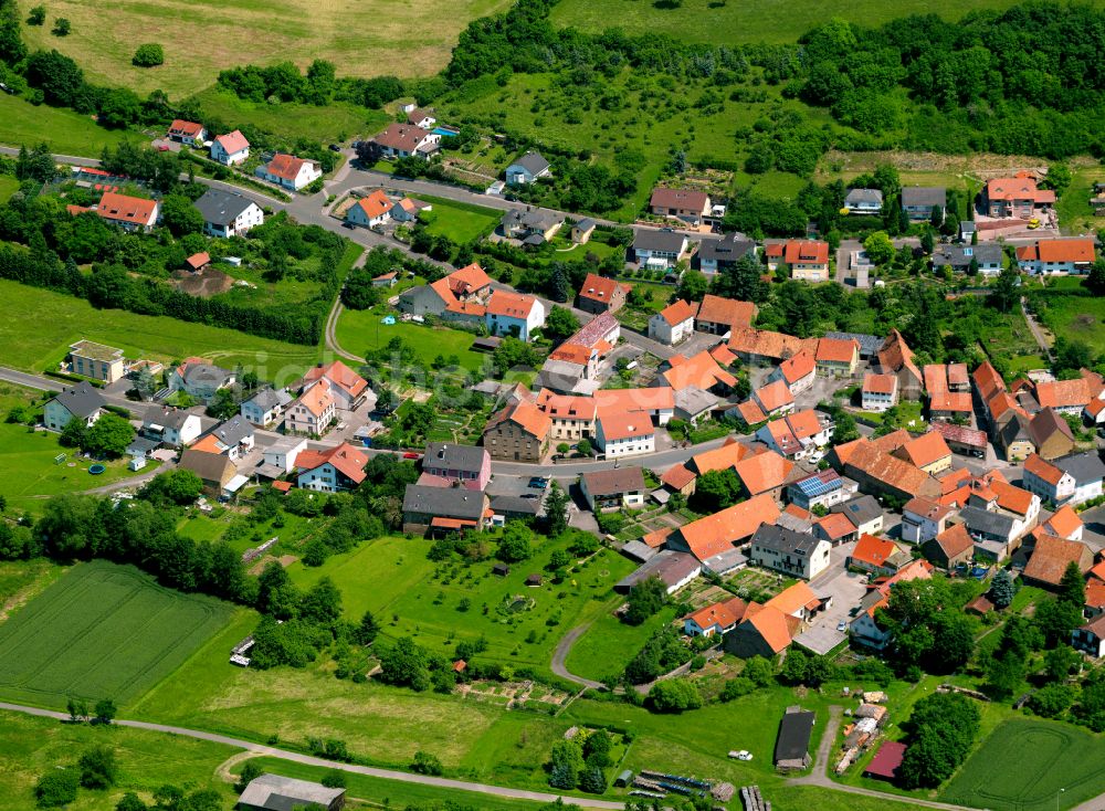 Gerbach from the bird's eye view: Agricultural land and field boundaries surround the settlement area of the village in Gerbach in the state Rhineland-Palatinate, Germany