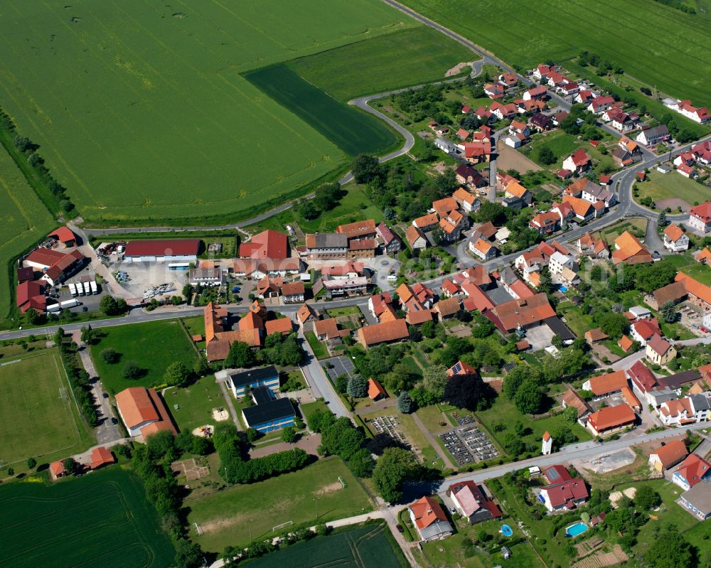 Gerbershausen from the bird's eye view: Agricultural land and field boundaries surround the settlement area of the village in Gerbershausen in the state Thuringia, Germany