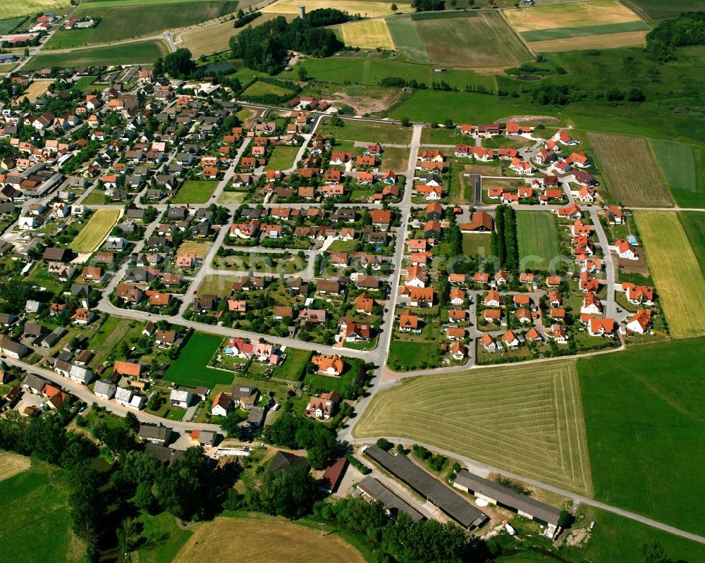 Gern from above - Agricultural land and field boundaries surround the settlement area of the village in Gern in the state Bavaria, Germany