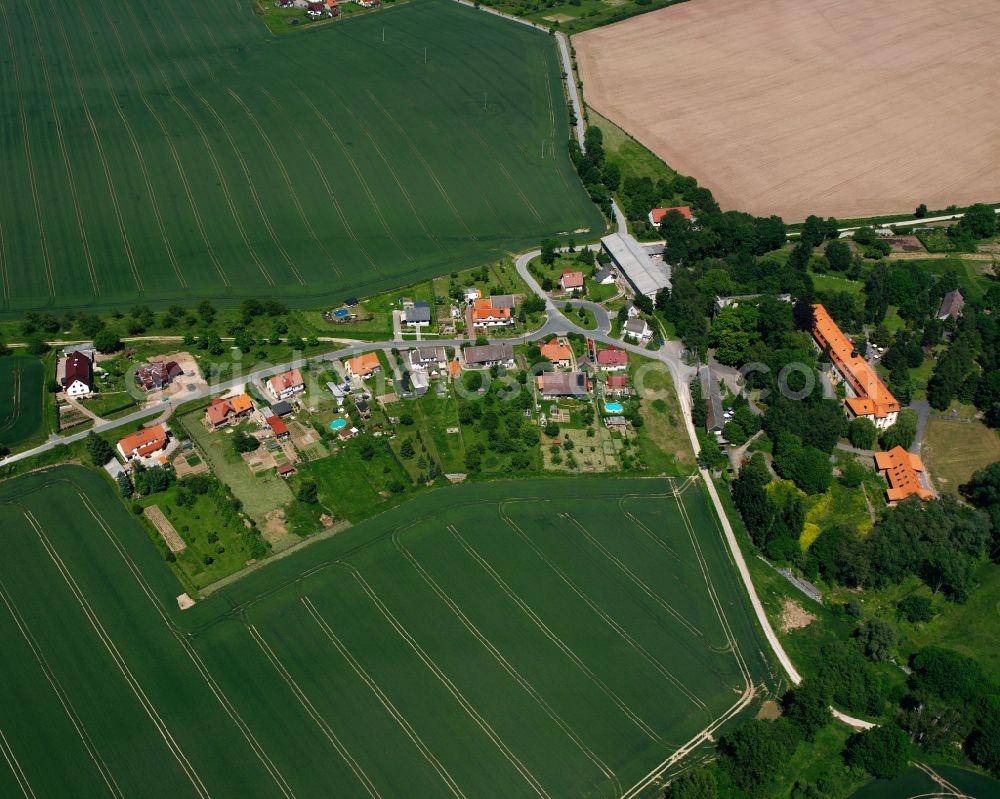 Gerode from above - Agricultural land and field boundaries surround the settlement area of the village in Gerode in the state Thuringia, Germany