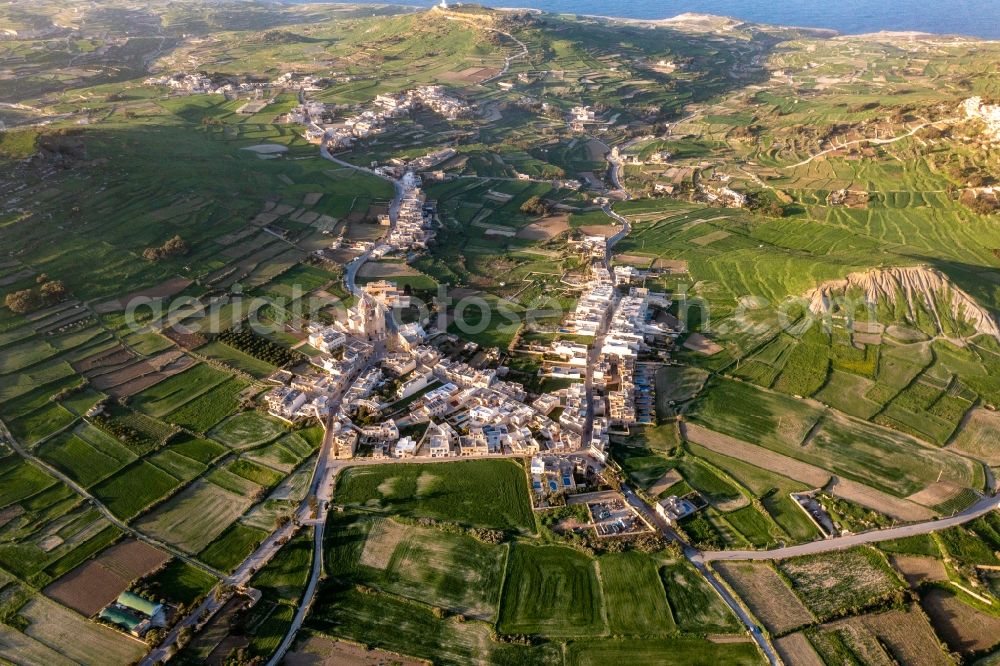 Aerial image L-Ghasri - Agricultural land and field boundaries surround the settlement area of the village in L-Ghasri in Gozo, Malta