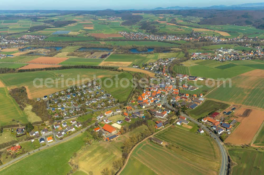 Giflitz from above - Agricultural land and field boundaries surround the settlement area of the village in Giflitz in the state Hesse, Germany