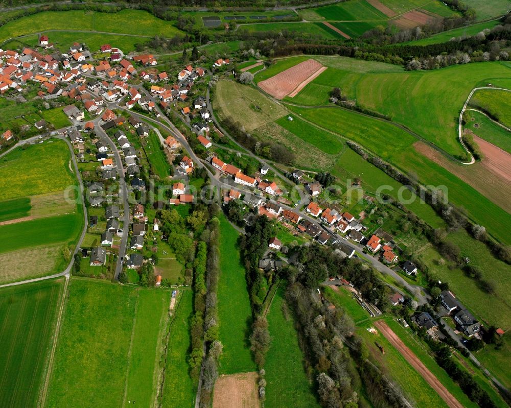 Aerial image Gittersdorf - Agricultural land and field boundaries surround the settlement area of the village in Gittersdorf in the state Hesse, Germany