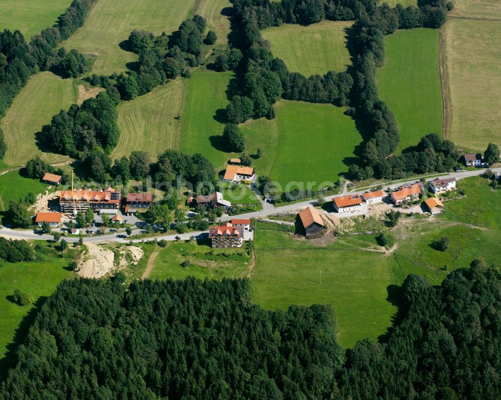 Glashütt from above - Agricultural land and field boundaries surround the settlement area of the village in Glashütt in the state Bavaria, Germany