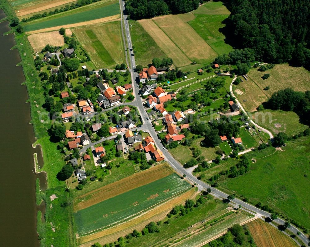 Glashütte from above - Agricultural land and field boundaries surround the settlement area of the village in Glashütte in the state Lower Saxony, Germany