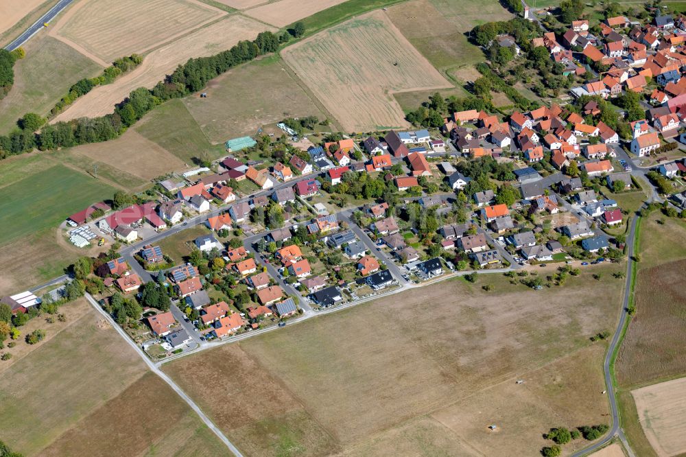 Aerial image Glasofen - Agricultural land and field boundaries surround the settlement area of the village in Glasofen in the state Bavaria, Germany