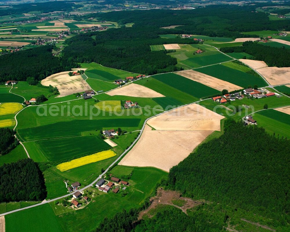 Aerial image Gmain - Agricultural land and field boundaries surround the settlement area of the village in Gmain in the state Bavaria, Germany