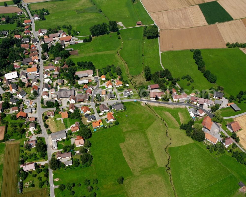 Günzkofen from above - Agricultural land and field boundaries surround the settlement area of the village in Günzkofen in the state Baden-Wuerttemberg, Germany