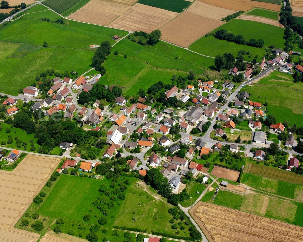 Günzkofen from the bird's eye view: Agricultural land and field boundaries surround the settlement area of the village in Günzkofen in the state Baden-Wuerttemberg, Germany