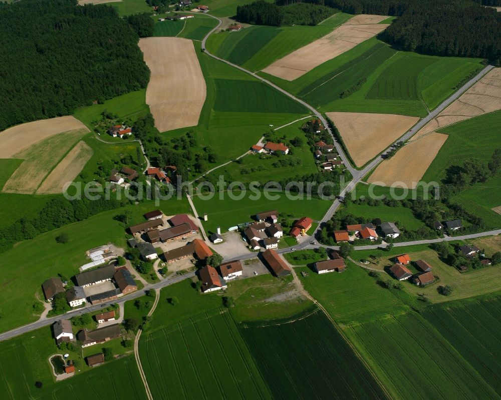 Aerial photograph Godlsham - Agricultural land and field boundaries surround the settlement area of the village in Godlsham in the state Bavaria, Germany