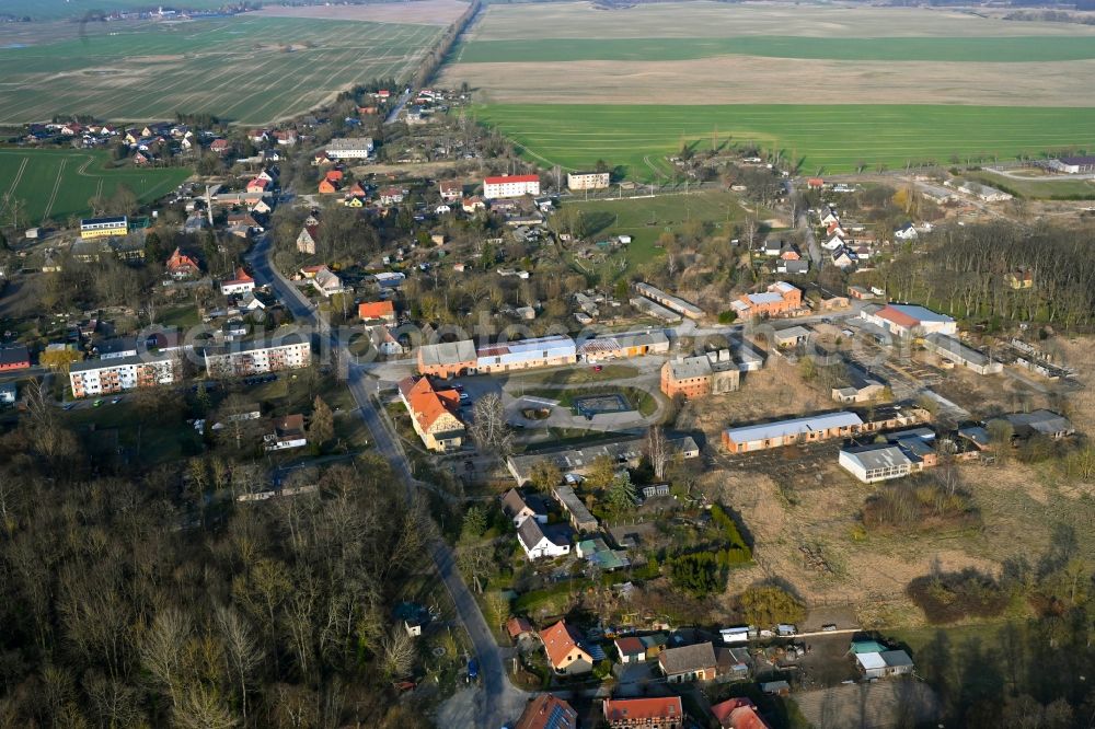 Gollmitz from above - Agricultural land and field boundaries surround the settlement area of the village in Gollmitz in the state Brandenburg, Germany