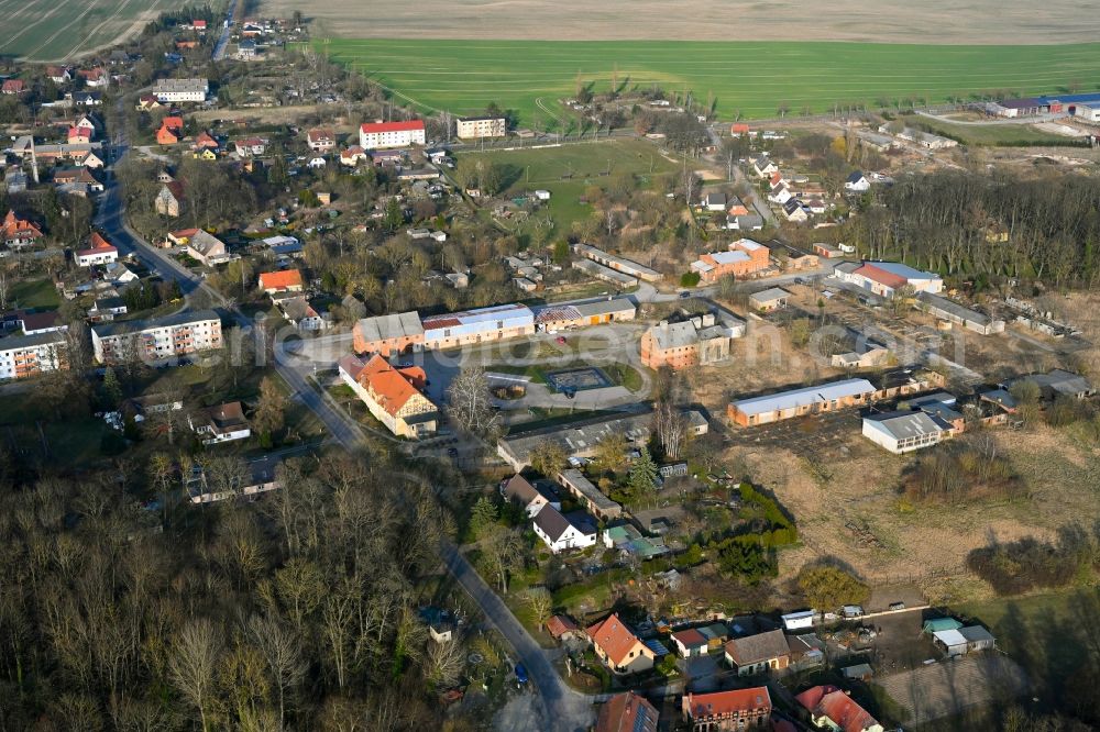 Gollmitz from the bird's eye view: Agricultural land and field boundaries surround the settlement area of the village in Gollmitz in the state Brandenburg, Germany