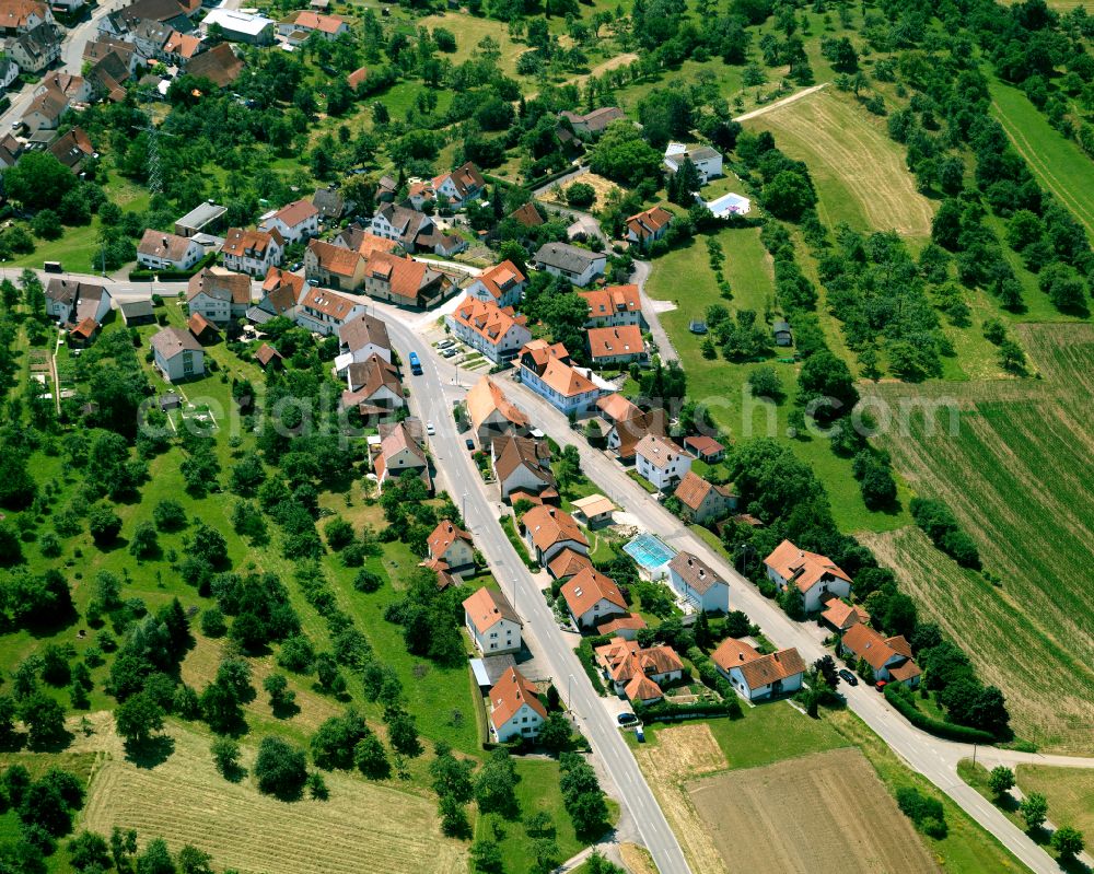 Gomaringen from above - Agricultural land and field boundaries surround the settlement area of the village in Gomaringen in the state Baden-Wuerttemberg, Germany