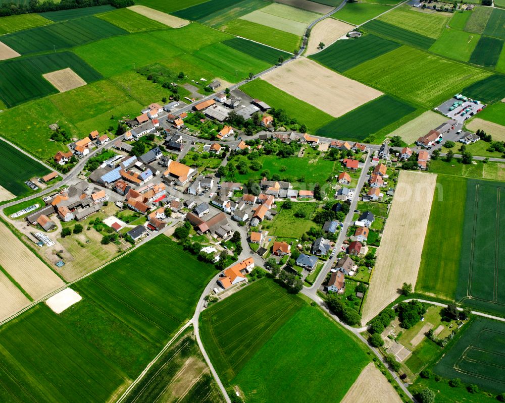 Aerial image Gontershausen - Agricultural land and field boundaries surround the settlement area of the village in Gontershausen in the state Hesse, Germany