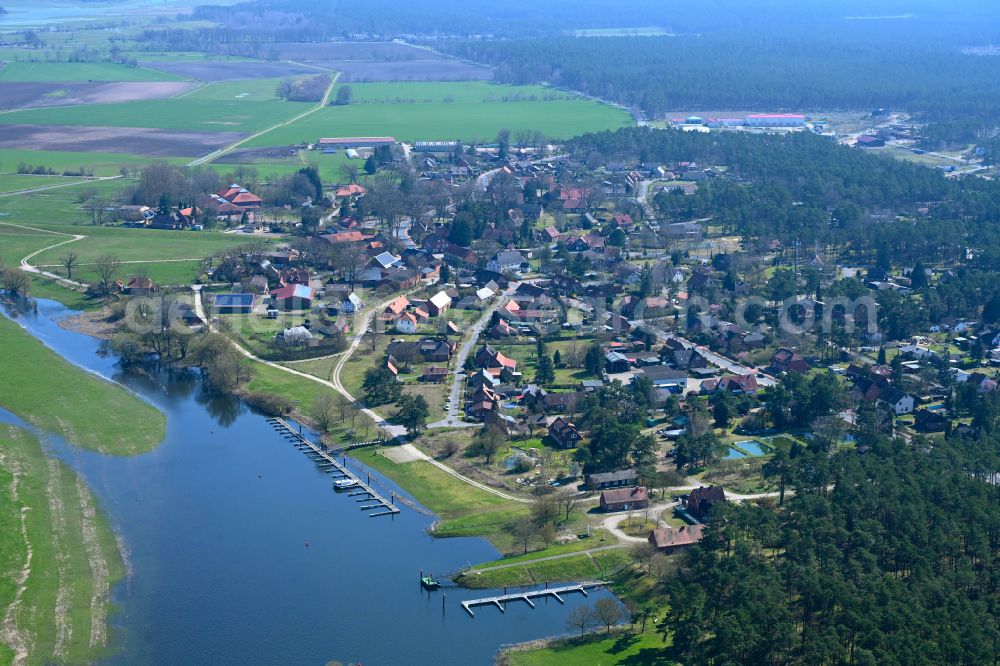 Gorleben from the bird's eye view: Agricultural land and field boundaries surround the settlement area of the village in Gorleben in the state Lower Saxony, Germany