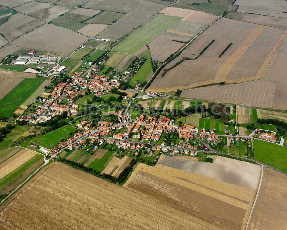 Aerial image Grabe - Agricultural land and field boundaries surround the settlement area of the village in Grabe in the state Thuringia, Germany