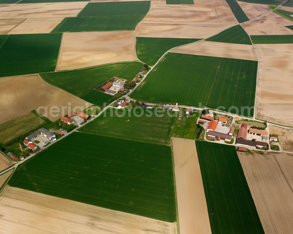 Aerial photograph Grafling - Agricultural land and field boundaries surround the settlement area of the village in Grafling in the state Bavaria, Germany