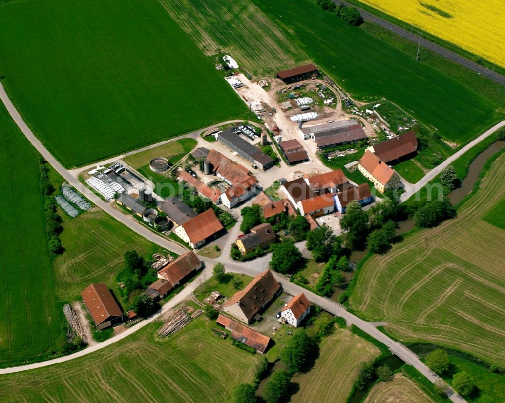 Görchsheim from the bird's eye view: Agricultural land and field boundaries surround the settlement area of the village in Görchsheim in the state Bavaria, Germany