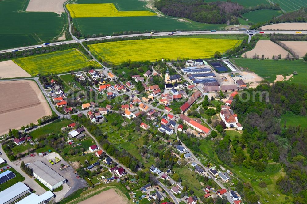 Aerial image Gröditz - Agricultural land and field boundaries surround the settlement area of the village in Groeditz in the state Saxony, Germany