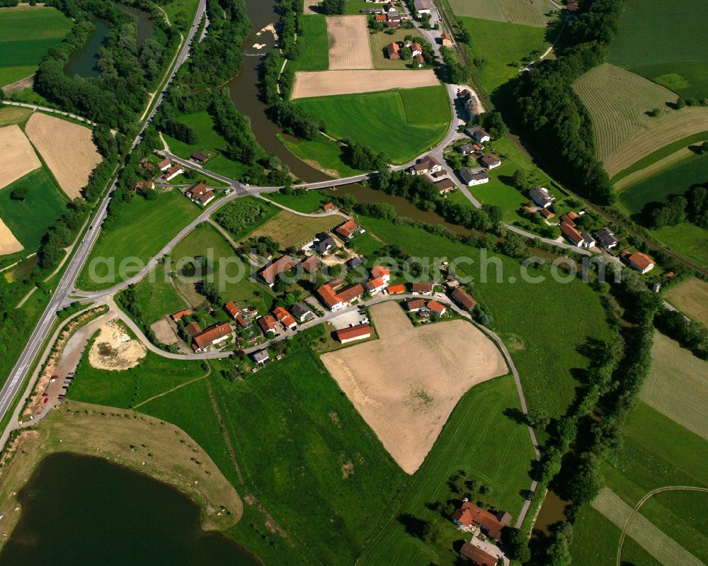 Gries from above - Agricultural land and field boundaries surround the settlement area of the village in Gries in the state Bavaria, Germany