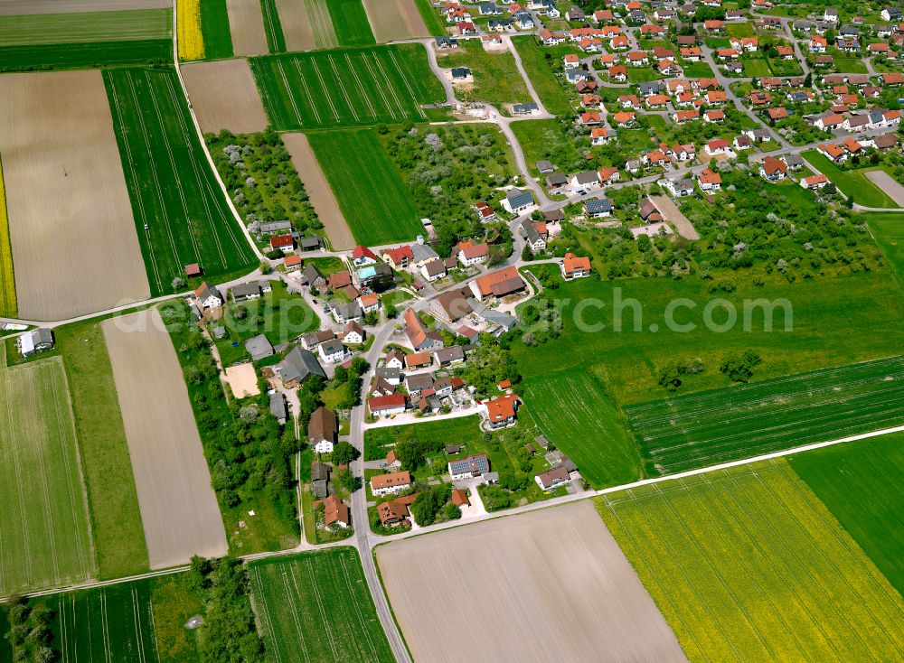 Griesingen from above - Agricultural land and field boundaries surround the settlement area of the village in Griesingen in the state Baden-Wuerttemberg, Germany