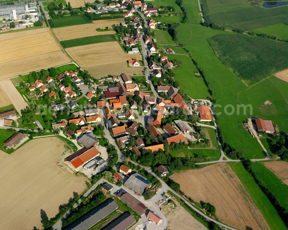 Grimmschwinden from above - Agricultural land and field boundaries surround the settlement area of the village in Grimmschwinden in the state Bavaria, Germany